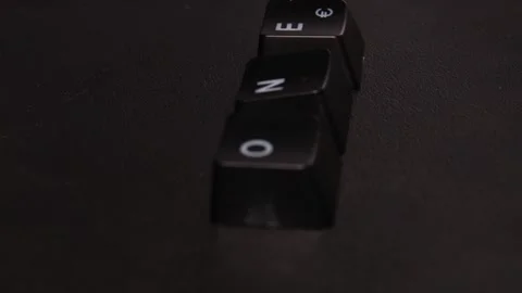 The thick black mechanical keyboard key black surface rotates 360 degrees Stock Footage 250980727