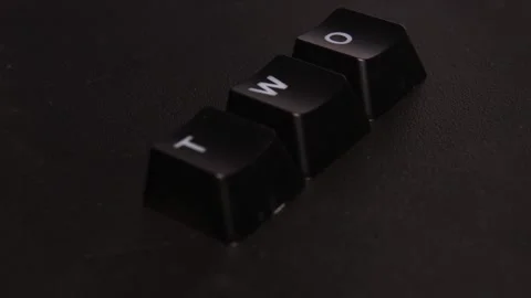 The thick black mechanical keyboard key black surface rotates 360 degrees Stock Footage 250981163