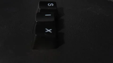 The thick black mechanical keyboard key connected to the blue switch on a black Stock Footage 250981679