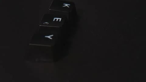 The thick black mechanical keyboard key black surface rotates 360 degrees Stock Footage 250982683