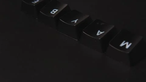 The thick black mechanical keyboard key black surface rotates 360 degrees Stock Footage 250982887