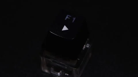 The thick black mechanical keyboard key connected to the blue switch on a black Stock Footage 253821759
