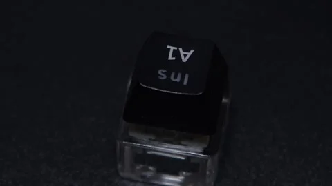The thick black mechanical keyboard key connected to the blue switch on a black Stock Footage 253822240