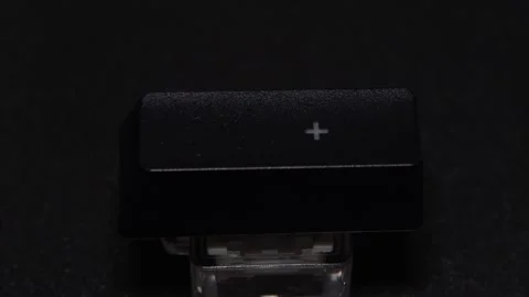 The thick black mechanical keyboard key connected to the blue switch on a black Stock Footage 253823244