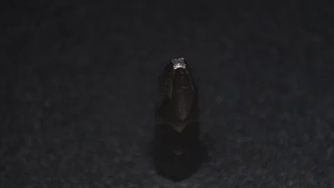 The thick black mechanical keyboard key connected to the blue switch on a black Stock Footage 253866337
