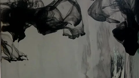 Thick black paint falling down in clear water on grey background Stock Footage 291110785