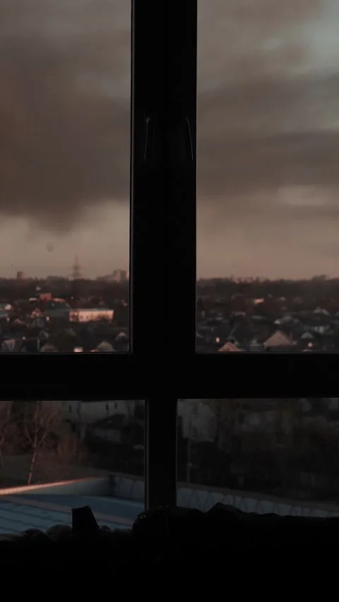 Thick black smoke rises into the sky from a burning after a rocket attack Stock Footage 327216087