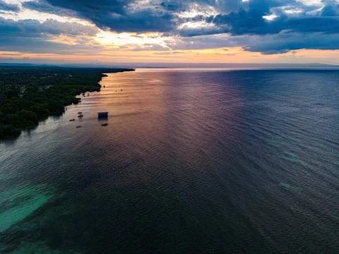 Thick blue clouds during sunset seen from Walakiri Beach Stock Photos