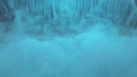 Thick blue smoke with red lighting creeps over the surface. bottom view Stock Footage 276317967