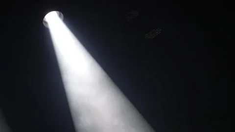 Thick bright white stage spotlight beam shining through smoke Stock Footage 346360674