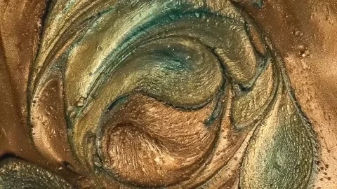 A thick bronze mass of glitter that easily melts and turns into large balloon Stock Footage 218372567