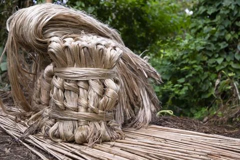 A thick brown  bundle of raw jute has on the ground Stock Photos