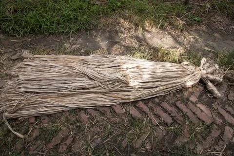 A thick brown  bundle of raw jute has on the ground Stock Photos