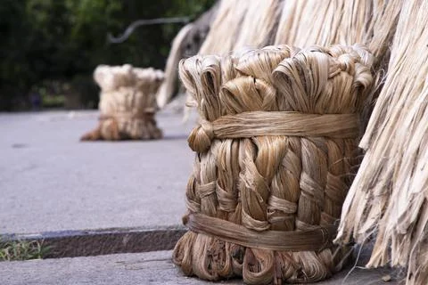 A thick brown  bundle of raw jute has on the ground Stock Photos