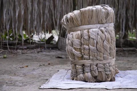 A thick brown  bundle of raw jute has on the ground Stock Photos