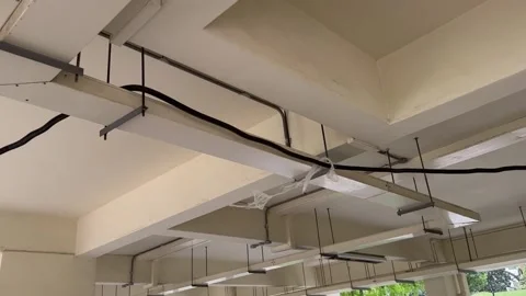 Thick Cable connecting to power hangs on the ceiling 動画素材 238792651