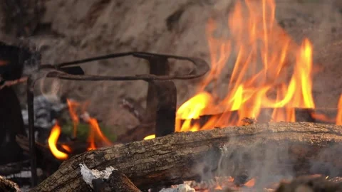 Thick cast-iron frying pan with fried meat over high heat in rural areas. Stock Footage 214660590