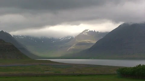 Thick cloud cover over Arctic fjord valley Stock Footage 37270019