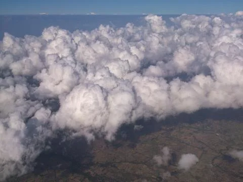 Thick clouds above during flight Stock Photos