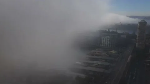 Thick clouds and fog over Sydney Harbour Circular Quay wharves and waterfront. Stock Footage 135307485