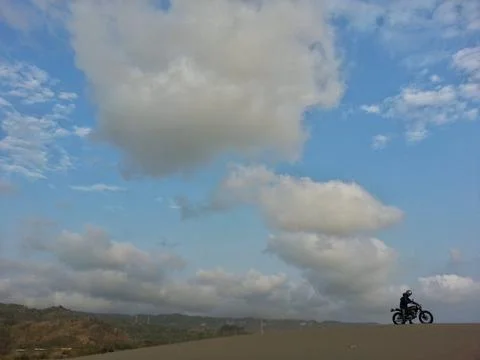 Thick clouds and the man Stock Photos