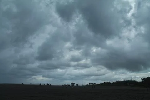 Thick clouds at the beach Stock Photos