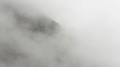 Thick clouds blocking view on rock walls,4k,timelapse Stock Footage 230211138