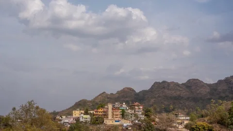 Thick clouds fly over the mountain village. Timelapse Stock-Footage 129222233