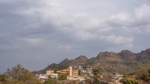 Thick clouds fly over the mountain village. Timelapse Stock-Footage 129222326