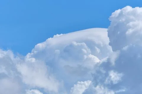 Thick clouds high in the sky in summer close up Stock Photos