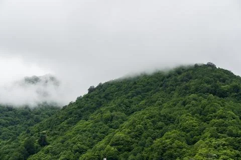 Thick clouds low over the mountains of Georgia Stock Photos