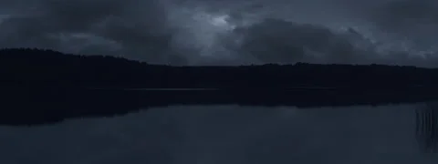 Thick Clouds Over the Lake at Night Anamorphic Stock-Footage 140910729