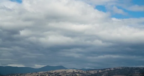 Thick Clouds Over Mountains Timelapse 4K Stock Footage 113921796