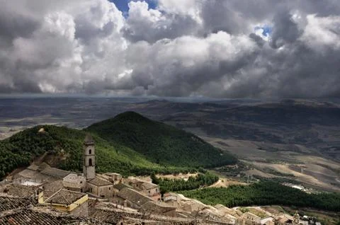 Thick clouds over a small settlement Stock Photos