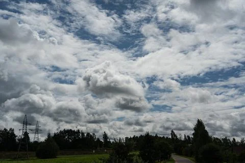 Thick clouds over the village Stock Photos