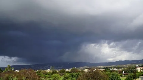 Thick clouds passing with some rain Stock Footage 84784965