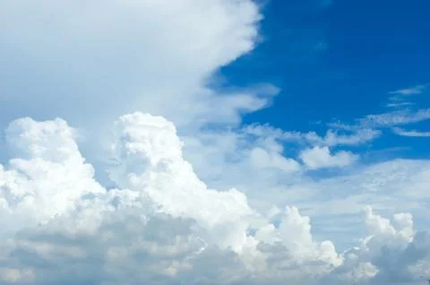 Thick clouds in summer blue sky. Cloudy bright beauty in the sun, bright an.. Stock Photos