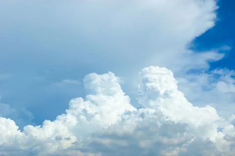 Thick clouds in summer blue sky. Cloudy bright beauty in the sun, bright an.. Stock Photos