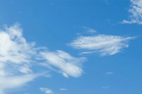 Thick clouds in summer blue sky. Cloudy bright beauty in the sun, bright an.. Stock Photos