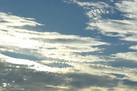 Thick clouds in summer blue sky. Cloudy bright beauty in the sun, bright an.. Stock Photos