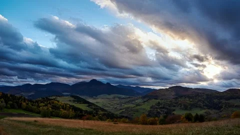 Thick clouds at sunset. Colorful trees in autumn.Autumn rural landscape at dusk. Stock Footage 164000708