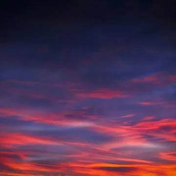 Thick clouds at sunset Stock Photos