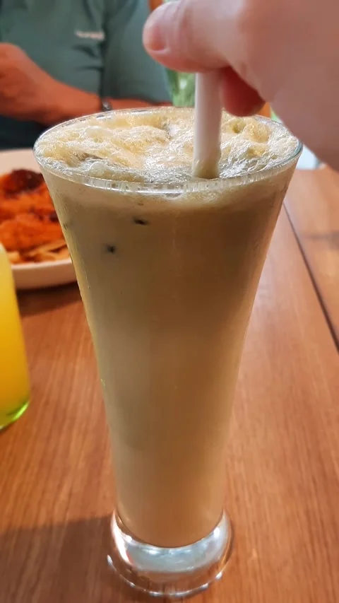 Thick Cold Avocado Matcha Yogurt Coffee Drink Stirred in Dewy Glass Restaurant Stock Footage 312612503