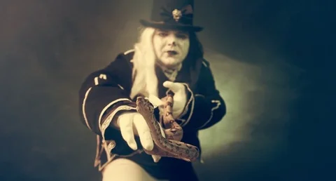 Thick crazy actor in white makeup with a snake. Masquerade. Video stock 70986653