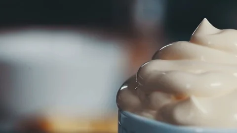 Thick cream in a dish Stock Footage 103797477