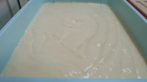 Thick Creamy Cake Batter Poured in Baking Pan Video stock 343587641