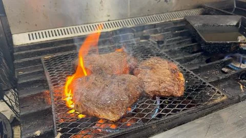 Thick-cut beef steak grilled over open flame, Japanese izakaya style, Japan Stock Photos