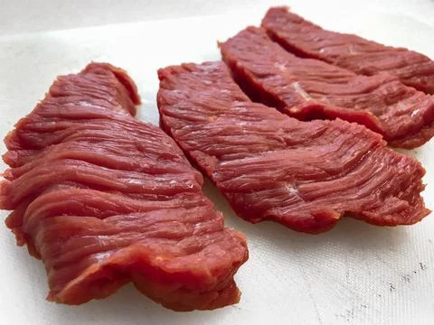 Thick cut of red beef meat on white Foto stock