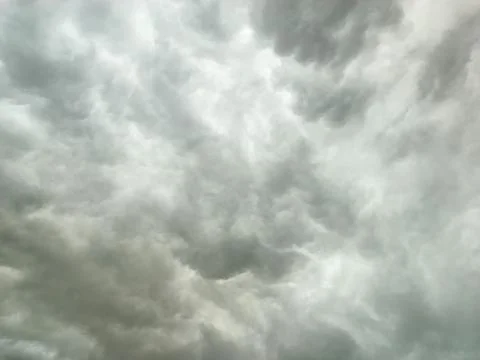 Thick dark clouds moved quickly ahead of heavy rain. Copy space Stock Photos