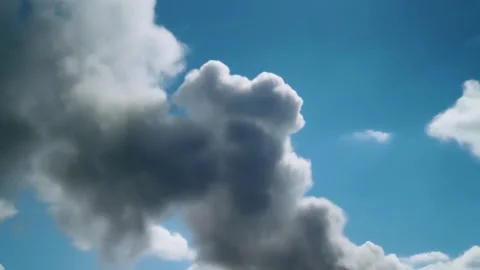 Thick Dark Smoke Billowing Against Blue Sky 스톡 동영상 338321494